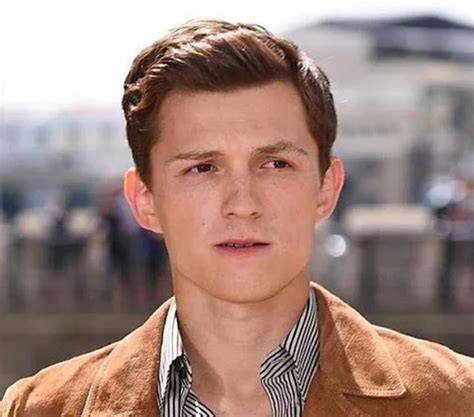 Tom Holland natural curly hair on red carpet