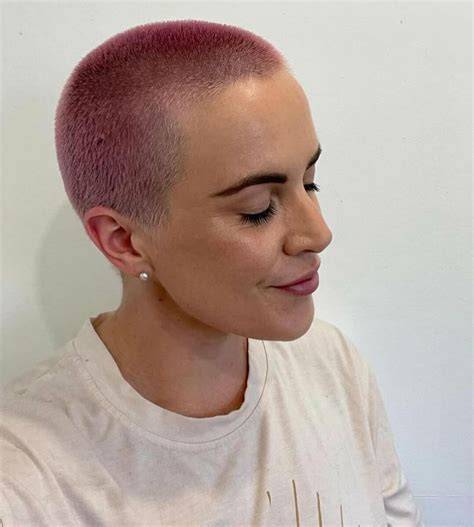 Pink hair buzz cut at stadium